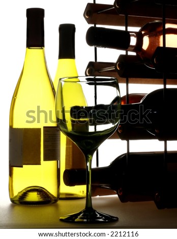 Wine glass, bottles and wine rack on white background.