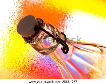 Abstract background design made from a bottle, a stopper and numerous colors.