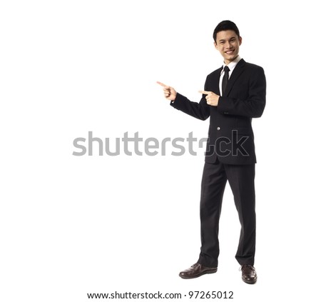 Young Asian Corporate Man pointing wit two fingers over white background