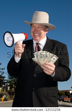 Man with megaphone and cash.