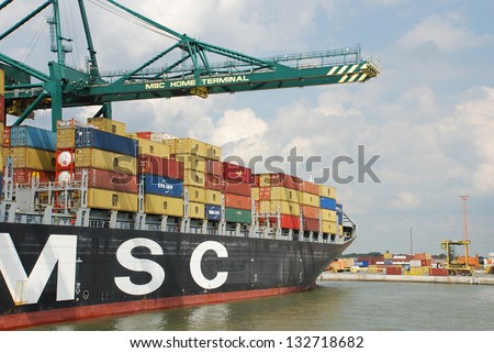 ANTWERP, BELGIUM - AUGUST 8: Loading and unloading of container-ships August 8, 2010 in Antwerp, Belgium. MSC Home terminal, one of the biggest terminals in the port.
