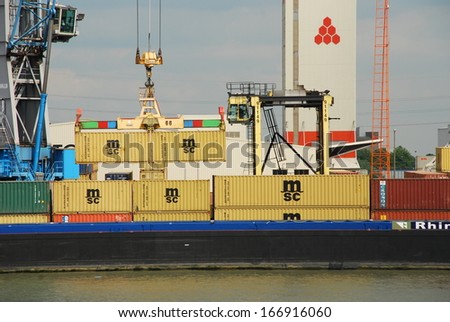 ANTWERP, BELGIUM - AUGUST 8: Loading and unloading of container-ships August 8, 2010 in Antwerp, Belgium. These photos are taken on the MSC Home terminal, one of the biggest terminals in the port