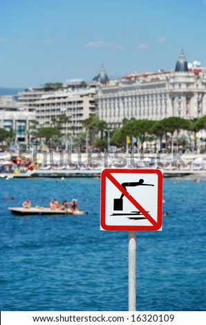 A swimming not allowed sign at the beach in Cannes