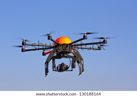 Flying drone in the sky. Flying with an octocopter for video and photo productions