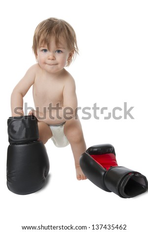 Photo shows a little baby with boxing shoes. Isolated on white.