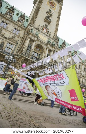 HAMBURG, GERMANY - JUNE 29, 2014: Demonstration for the community health in Germany. Messages on a washing line in front of the city hall. Demonstration shows the state of emergency in Germany.