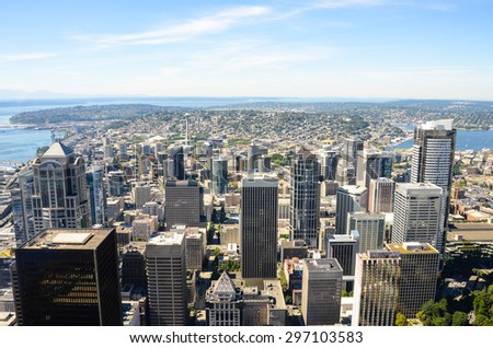 SEATTLE, WASHINGTON - AUGUST 7, 2013: View of the city looking north from the 76th floor of the Columbia Center. The Space Needle is dwarfed by the high-rise office towers in the downtown area.