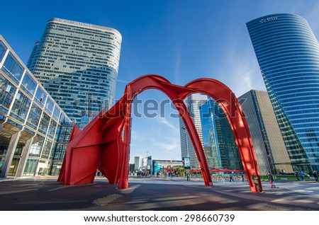 PARIS, FRANCE - OCTOBER 27, 2014: Modern sculptures are featured among the office buildings in La Defense, the government and business center of the city.