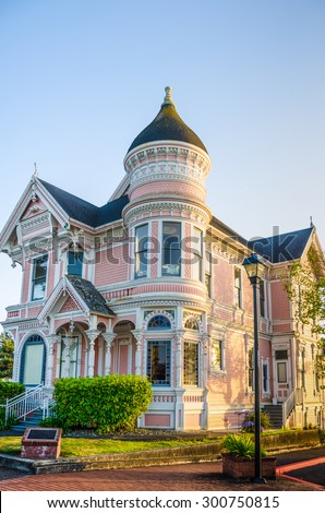 EUREKA, CALIFORNIA - JULY 23, 2012: The elegant Victorian mansion, known as the Pink Lady, was built in the Queen Anne architectural style, in Eureka California by lumber baron William Carson.