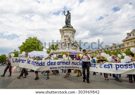 PARIS, FRANCE   AUGUST 7, 2015: People are demonstrating for the end of nuclear war at the Place de la Republique on the 70th anniversary of the bombing of Hiroshima and Nagasaki in Japan.