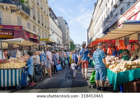PARIS, FRANCE - AUGUST 29, 2015: The open-air market in the Bastille district is one of the largest and busiest in the city selling fresh produce from France and other European countries.