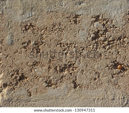 Old weathered  textured concrete  in a neutral shade perfect for grunge backgrounds and wallpapers.