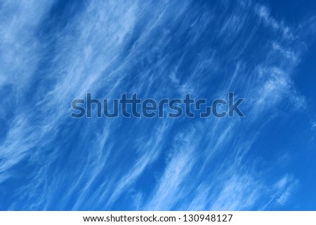High white  wispy cirrus clouds  in blue Australian sky  sometimes called mare\'s tails  indicate fine weather  now but  stormy  changes coming within a couple of days.