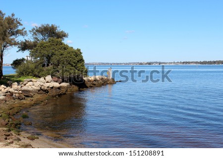Looking across the Swan River from the pleasant scenic  South Perth foreshore Western Australia on a fine morning in early spring.