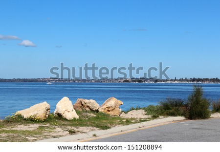 Looking across the Swan River from the pleasant scenic  South Perth foreshore Western Australia on a fine morning in early spring.