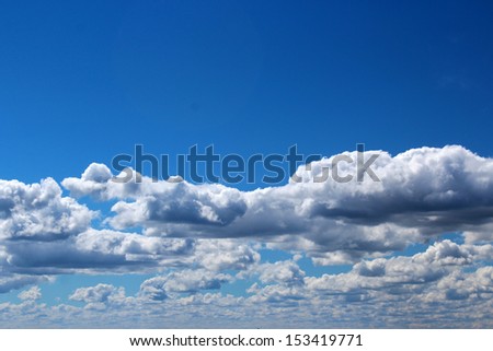White  and grey fluffy  cumulus clouds in blue Australian sky in early spring indicate a fine day ahead.
