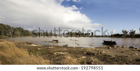 Panorama of the lake at the  Malbup Bird hide  in the  Tuart forest National park near Busselton south west Australia  on a cloudy afternoon after heavy late autumn rains .