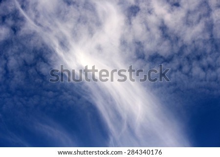 High white  wispy cirrus clouds  in  a blue Australian sky  sometimes called mare's tails   blown by high winds into long streamers indicate fine weather    but  stormy changes coming.