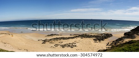 Panorama of the  vegetated dunes and Indian Ocean at Ocean Beach  Bunbury south western Australia on a sunny afternoon in late winter   is cool and inviting.
