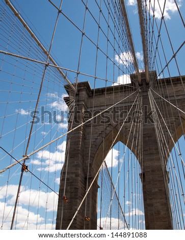 Brooklyn Bridge details against blue sky. New York City.