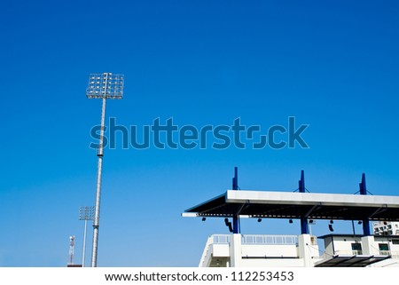 Lighting tower of stadium on sky background