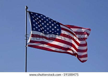 American flag against blue sky. See more flag images in my portfolio.