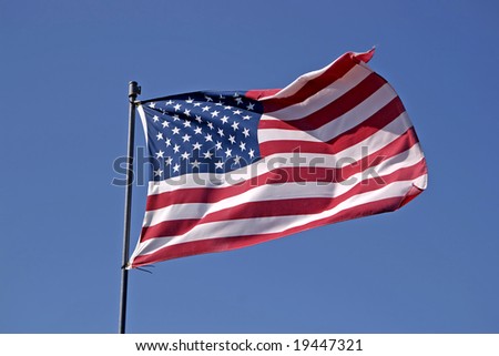 American flag against blue sky. See more flag images in my portfolio.