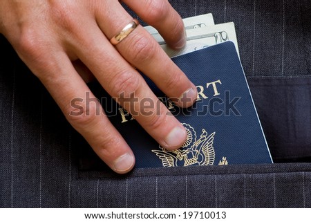 American passport and cash in business suit pocket. See more passport images in my portfolio.