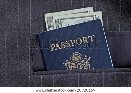 American passport and bills in business coat pocket