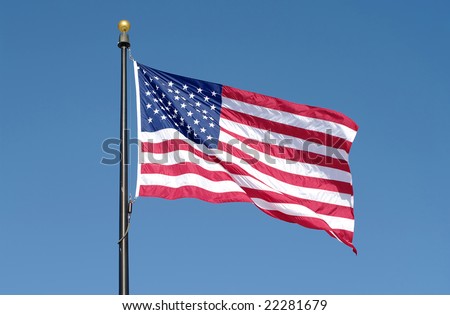American flag waving against blue sky. See more flag images in my portfolio.