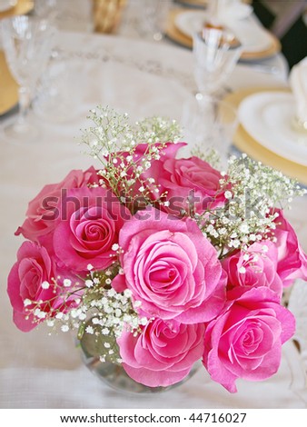 Roses arrangement on fancy table
