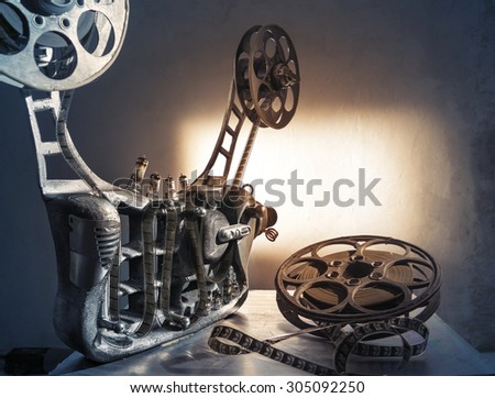 Unusual, old film projector with reels of film