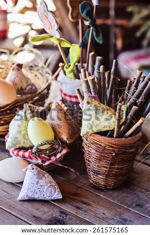 easter fabric chicken, eggs and decorations in country house in spring