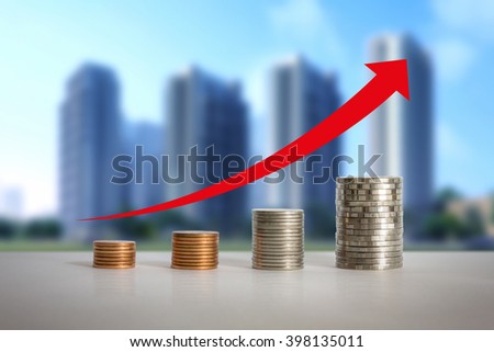 Stacks of coins in a growth real estate concepts.