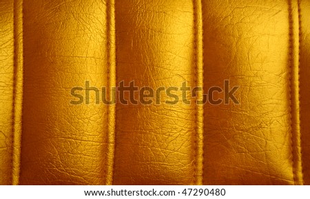 Golden leather background, piece of furniture