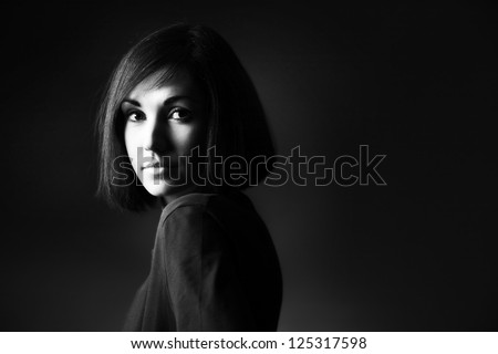 Black and white portrait of beautiful brunette woman with bob hairstyle