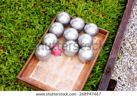 Petanque Metal Balls ready for Playing on Grass. Selective focus.
