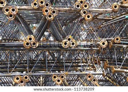 Steel pipes & bar on the rack before hot-dip galvanized in warehouse.