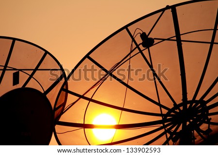 Satellite dish on sunset