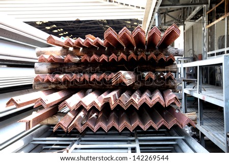 Steel angles bunch on the rack in warehouse