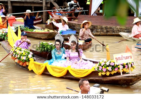 AYUTTHAYA, THAILAND - JULY 22 : Top view of beautiful flower boats in floating parade, the unique annual candle festival of Buddhist lent on July 22, 2013 in Ladchado, Ayutthaya province, Thailand