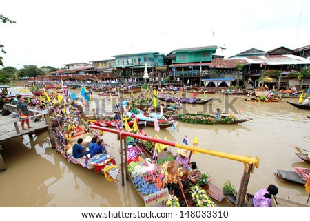 AYUTTHAYA, THAILAND - JULY 22 : Top view of beautiful flower boats in floating parade, the unique annual candle festival of Buddhist lent on July 22, 2013 in Ladchado, Ayutthaya province, Thailand