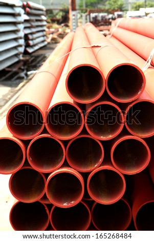Rusty steel tubes bunch in warehouse