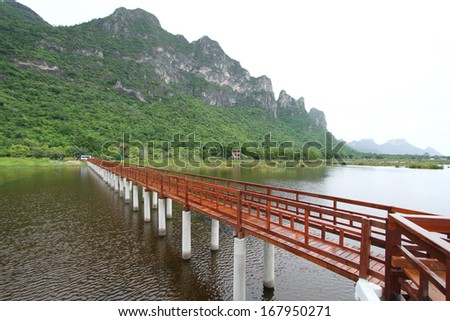 The wooden bridge in lotus lake and wood waterfront pavilion, at Khao Sam Roi Yot National Park in Thailand