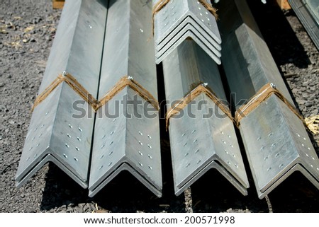 Hot-dip galvanized steel angles bunch on the rack in warehouse before shipment