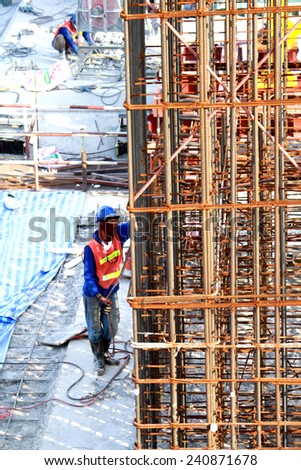 NONTHABURI-THAILAND-SEPTEMBER 20 : The worker welding for construction concrete bridge over the river at worksite on September 20, 2014, in Nonthaburi, Thailand