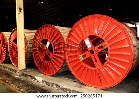 BANGKOK-THAILAND-JULY-22 : Old wooden reels & steel reels of power electrical cable in warehouse on July 22, 2014 Bangkok, Thailand.