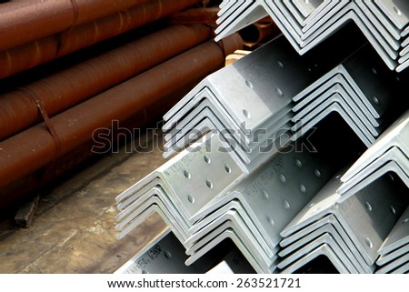 Hot-dip galvanized steel angle bunch on the rack in warehouse before shipment