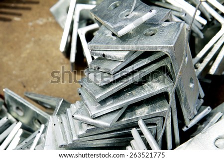 Hot-dip galvanized steel angle bunch on the rack in warehouse before shipment