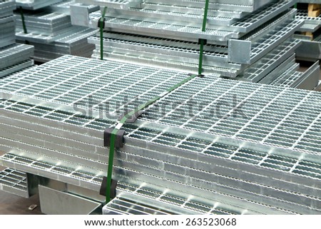 Hot-dip galvanized steel grating bunch on the rack in warehouse before shipment
